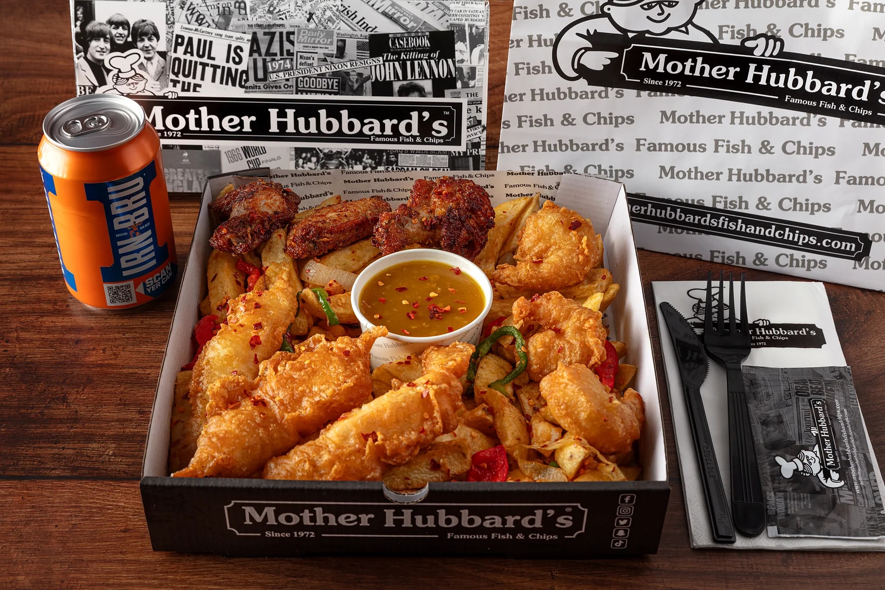 A loaded Mother Hubbard's box of salt and pepper chicken, chips and dip