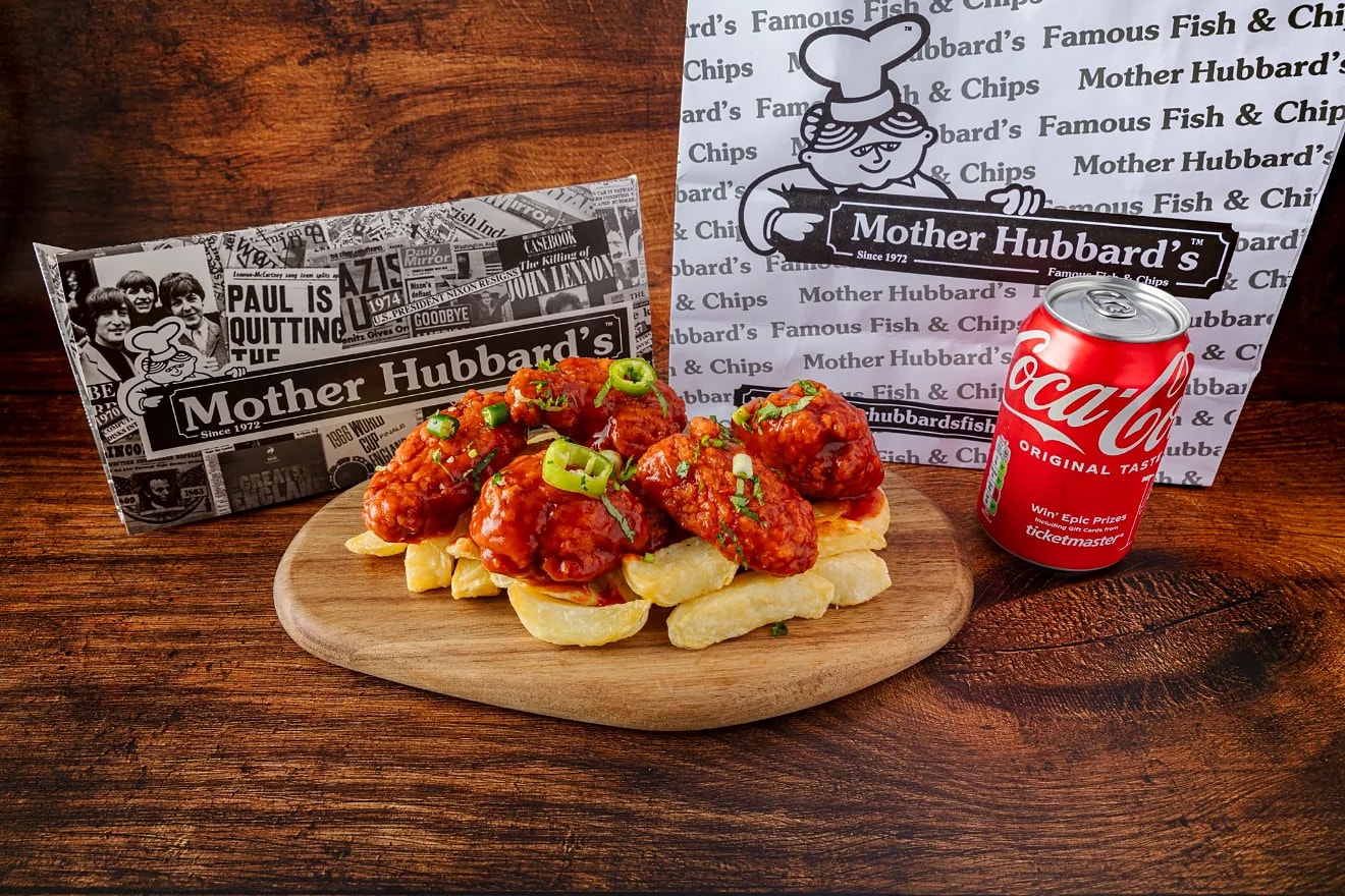 Dynamite hot wings on chips with a drink